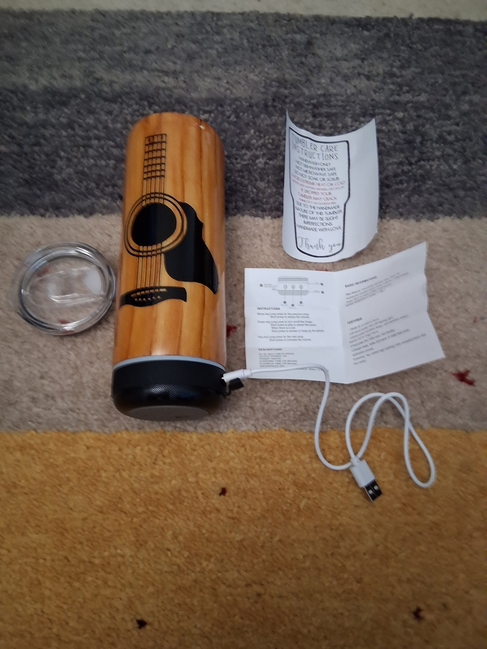 Acoustic guitar tumbler with speaker